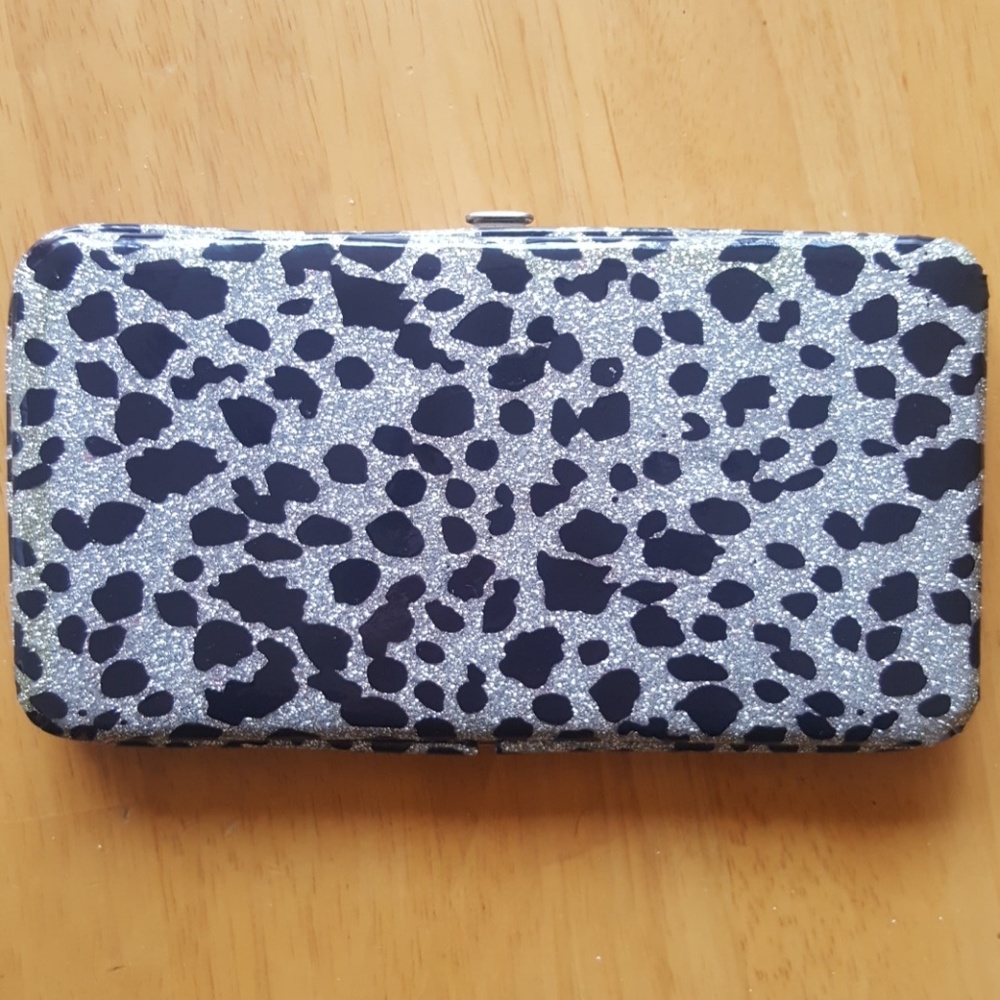 Silver and black snap close clutch